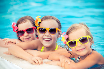 Happy children in the swimming pool