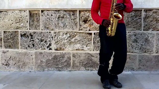 Playing the saxophone on the street
