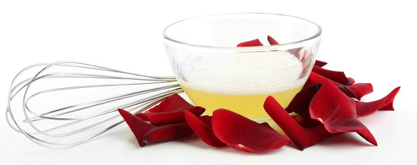 Fresh roses petals and egg whites, isolated on white. Candied rose petals concept
