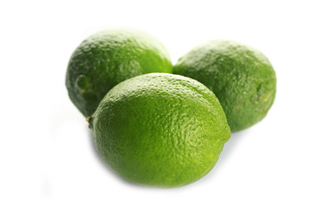 Group of fresh limes isolated on white