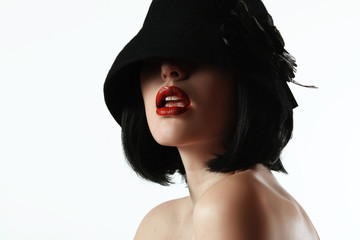 woman in a hat and a wig