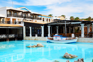 Open-air restaurant and swimming pool at luxury hotel, Crete, Gr