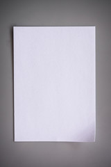 White paper on gray background with shadow