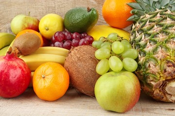 Naklejka na ściany i meble Group of various fruits on wooden plank