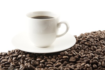 Line made of coffee beans with cup of coffee