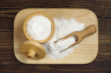 Salt in wooden bowl and scoop
