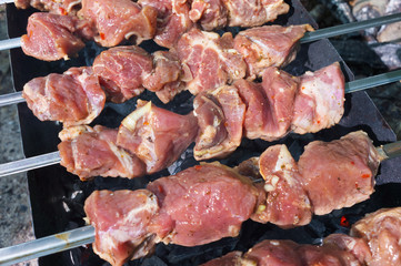 Grilling marinated meat on a grill