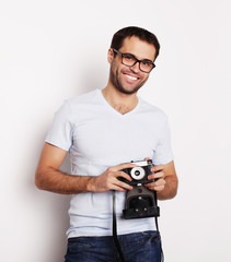 young man with a retro camera 