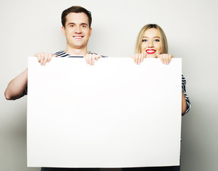 Couple holding a banner 