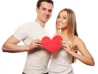 Fototapeta na wymiar Happy couple in love holding red heart