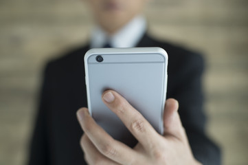 Businessman has a smartphone