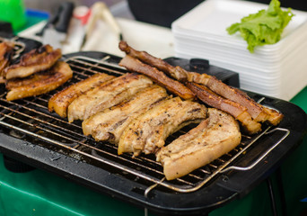grilling pork in  market .
