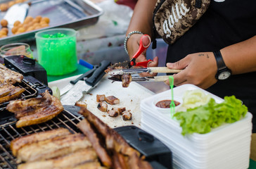 grilling pork in  market .