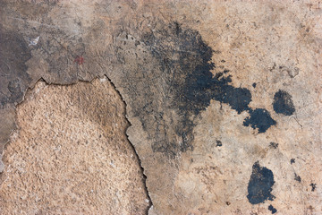 Cement floors are old and dirty.