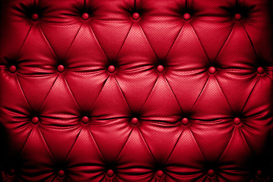 Red leather texture with buttoned pattern