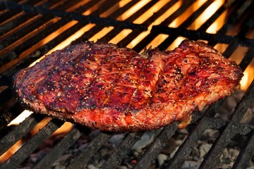 Single BBQ Beefsteak On The Hot Flaming Grill