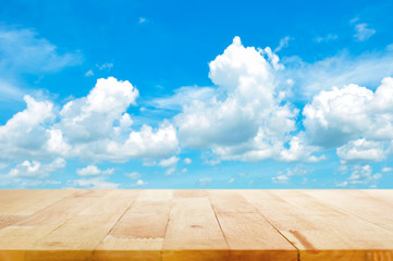 Wood table top on summer blue sky background