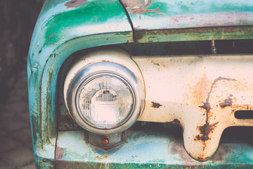 headlight of a vintage car with vintage filter effect