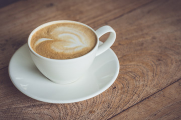 White coffee cup on the table at morning time