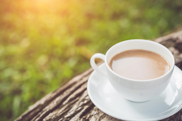 White coffee cup in the garden