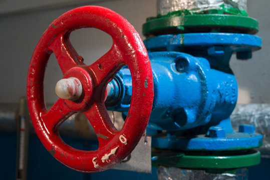 The red valve on a blue tube