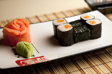 sushi rolls decorated with pickled ginger