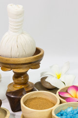 Obraz na płótnie Canvas Spa massage setting with towels compress balls and herb