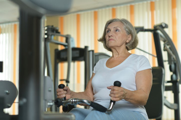 Fototapeta na wymiar Senior woman exercising in a gym