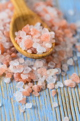 himalayan pink salt on wooden surface