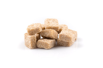 Heap brown sugar cubes isolated