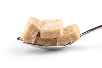 Cubes of sugar on a spoon
