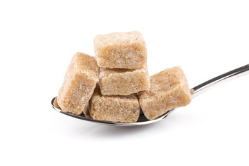 Cubes of sugar on a spoon