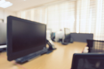 abstract blur background table work in office with computer pc