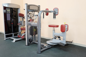 Fototapeta na wymiar Modern interior of a fitness club gym with sport equipment 