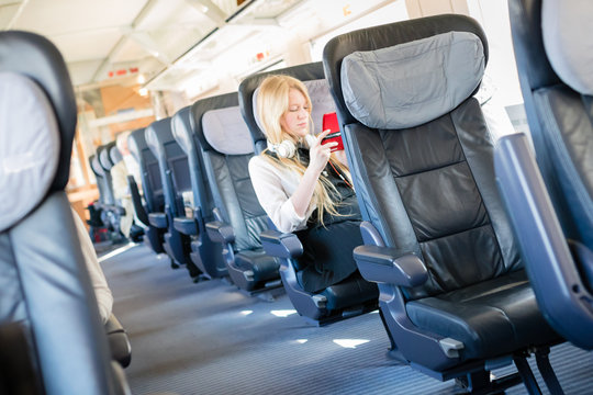 Young woman travelling business class