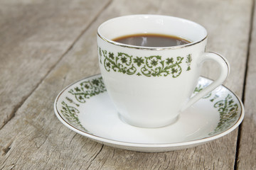 Coffee on wooden plank background