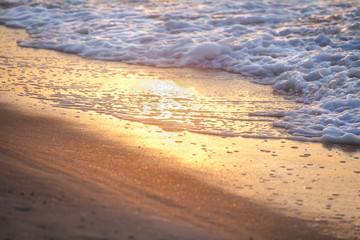 Sea wave on sandy beach