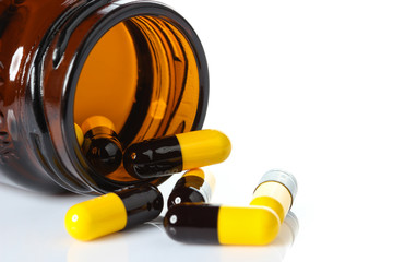 Opened pill with medicine powder