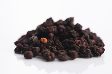 Dried schisandra chinensis fruits isolated on white background