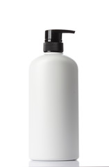  plastic bottles of body care and beauty products on white