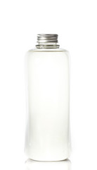  plastic bottles of body care and beauty products on white