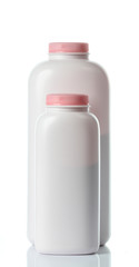  plastic bottles of body care and beauty products on white