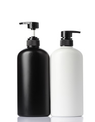  plastic bottles of body care and beauty products on white