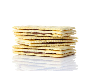 Sandwich biscuits with chocolate on white background