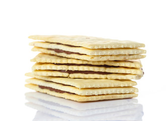 Sandwich biscuits with chocolate on white background