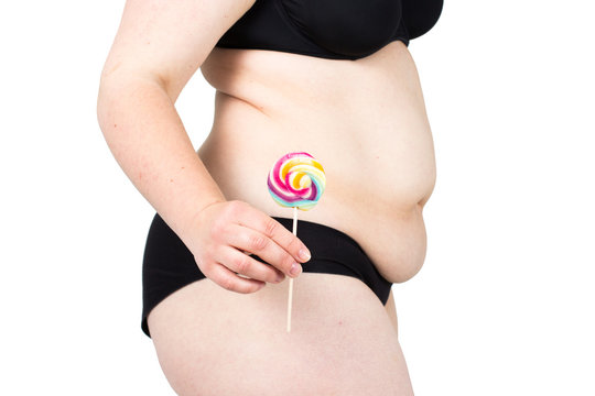 
Woman showing her fat body and holding a lollipop. Healthy lifestyles concept and diet.
Obese neglected body isolated over white background.