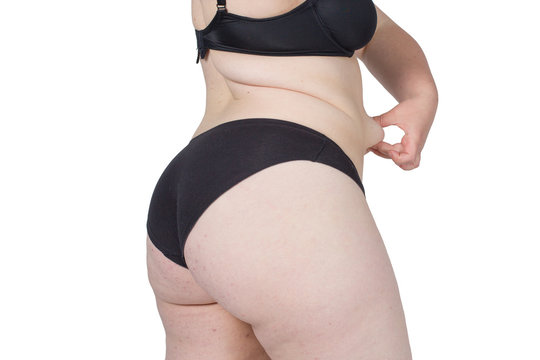 Obese neglected body isolated over white background.
Woman showing her fat body. Healthy lifestyles concept.