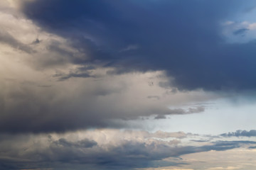 Sunlight is streaming through storm clouds