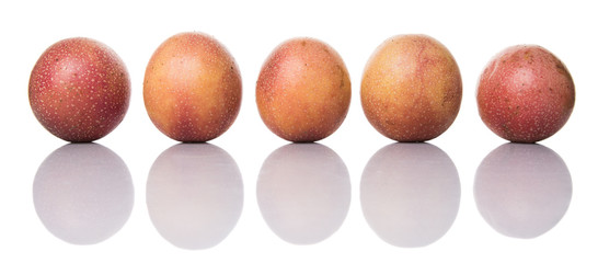 Passion fruit over white background