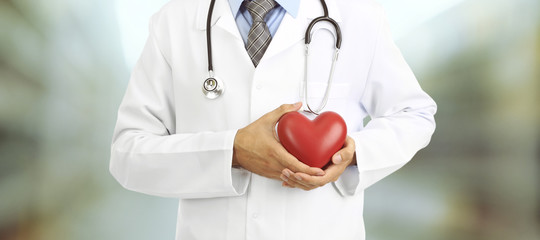Doctor with heart in hospital